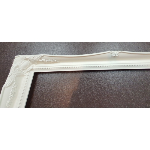 107A - 2 fully moulded, white picture frames for pictures sized 16ins. x 20 ins. Size: 59.5cm x 49.5 cm.