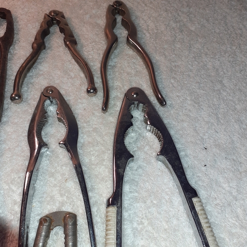 2 - 7 sets of metal nutcracker. Three have Italian makers marks.