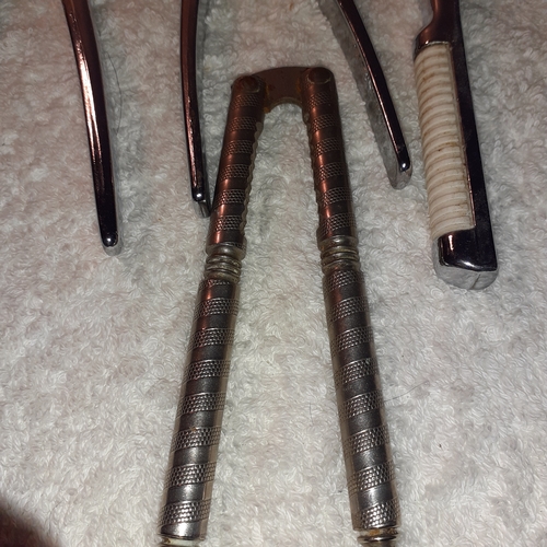 2 - 7 sets of metal nutcracker. Three have Italian makers marks.