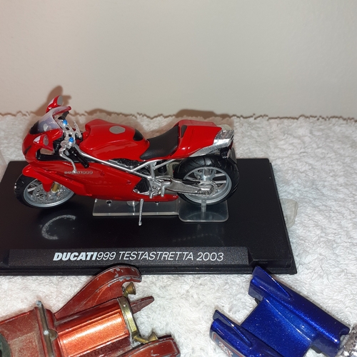 13 - A quantity of diecast vehicles including a Ducatti 999 Testastretta 2003 and some hot wheels and a m... 