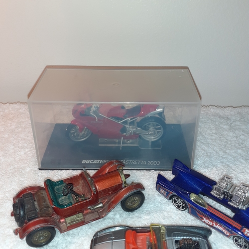 13 - A quantity of diecast vehicles including a Ducatti 999 Testastretta 2003 and some hot wheels and a m... 