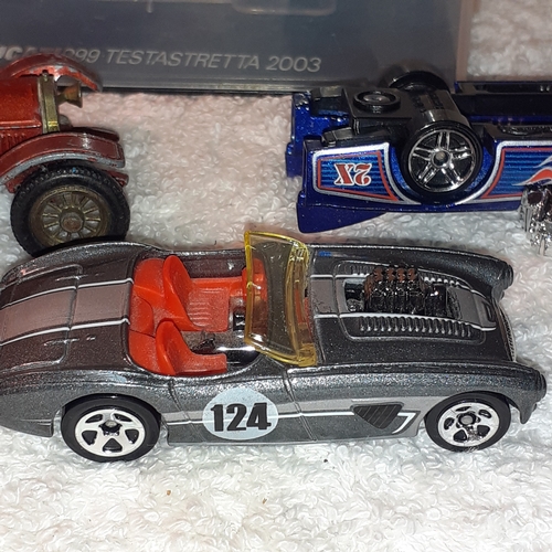 13 - A quantity of diecast vehicles including a Ducatti 999 Testastretta 2003 and some hot wheels and a m... 