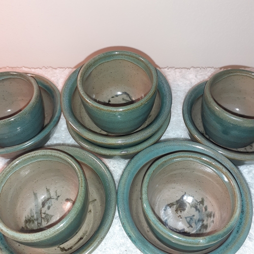 12 - 5 glazed pottery egg cups. 6 little matching saucers. Unusual swirl painted pattern on bases. No dam... 