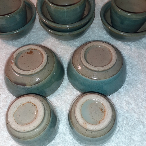 12 - 5 glazed pottery egg cups. 6 little matching saucers. Unusual swirl painted pattern on bases. No dam... 