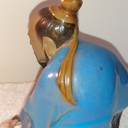 14 - Chinese mud man ornament with duck. App 17cm tall. Cannot see a stamp mark underneath. No damage.