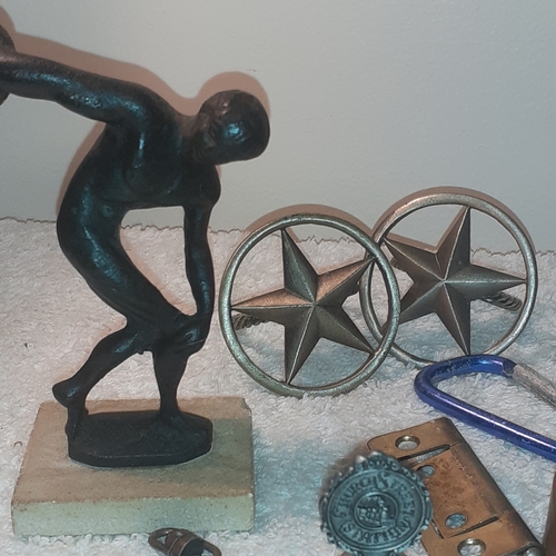 19 - An interesting lot of metal items including cast iron athlete, copper bracelet, copper ware ashtray,... 