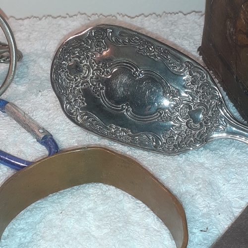 19 - An interesting lot of metal items including cast iron athlete, copper bracelet, copper ware ashtray,... 