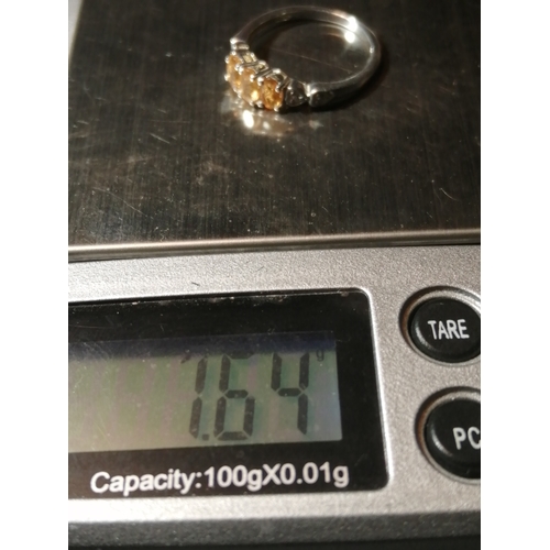 24A - Silver ring set with trilogy of yellow gemstones 1.64 grams Size N