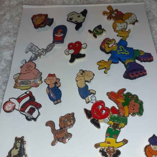 32 - Collection of enamelled pin/lapel badges including cartoon characters,  charities and more