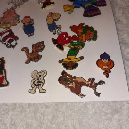 32 - Collection of enamelled pin/lapel badges including cartoon characters,  charities and more