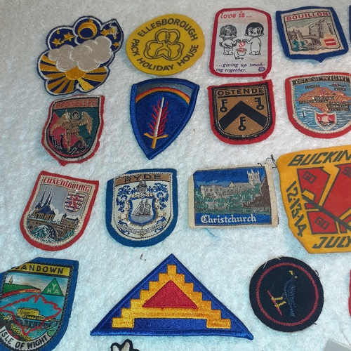 36 - A collection of mostly vintage sewing on badges and patches.