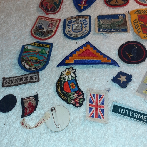 36 - A collection of mostly vintage sewing on badges and patches.