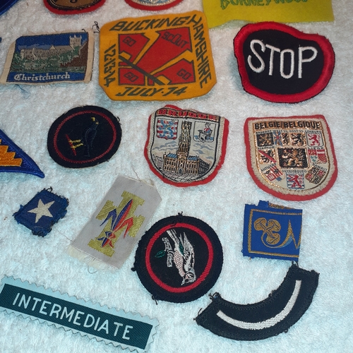 36 - A collection of mostly vintage sewing on badges and patches.