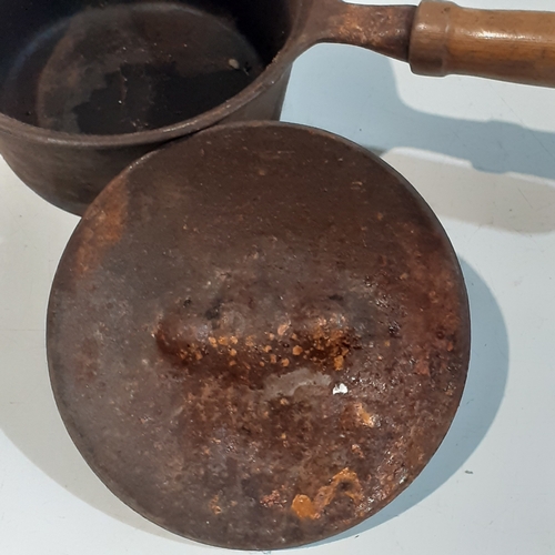 39 - Heavy cast iron saucepan. Solid but requires a clean up