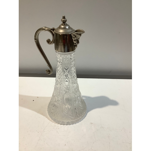 18 - English silver plated cut glass decanter with face for a spout