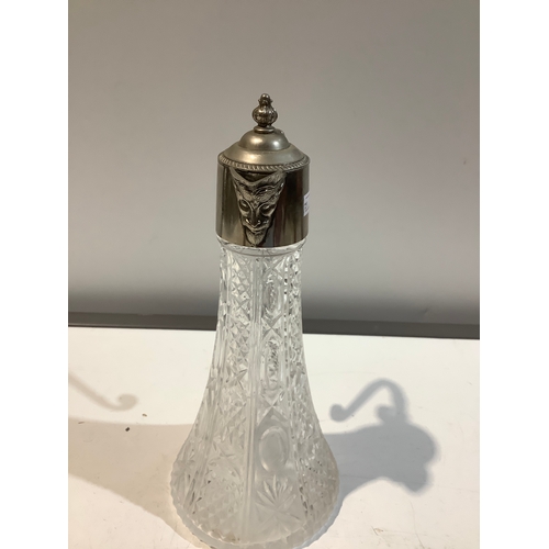 18 - English silver plated cut glass decanter with face for a spout