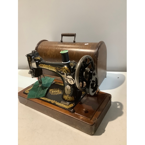 77 - Vintage Singer sewing machine in wooden case with key