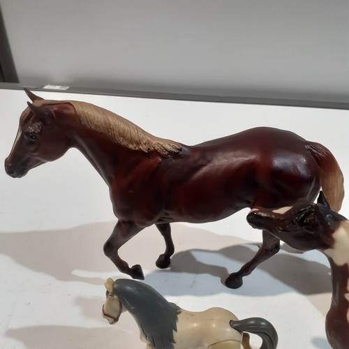 9 - 4 horse ornaments, made from plastic. Nice condition