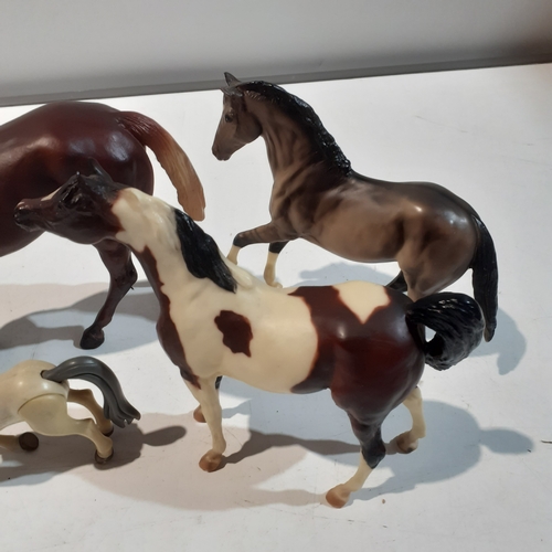 9 - 4 horse ornaments, made from plastic. Nice condition