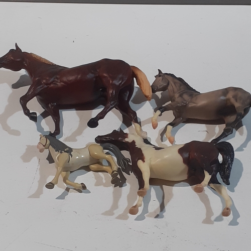 9 - 4 horse ornaments, made from plastic. Nice condition