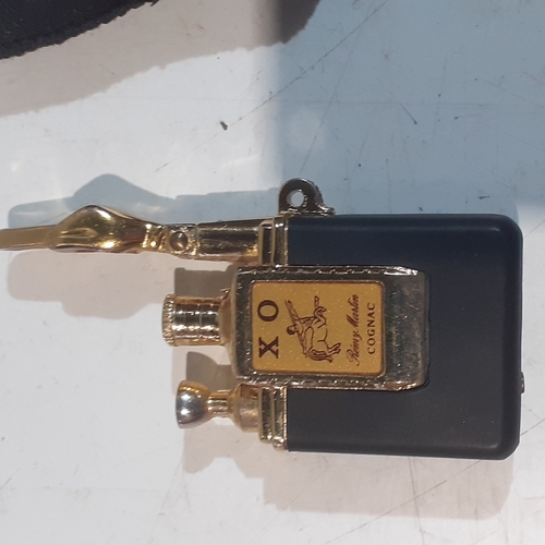 19 - XO remy martin zipper style lighter. Not tested but good condition