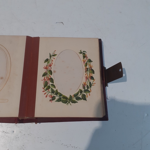 29 - Vintage possibly antique photograph album with individual pages decorated with painted flower border... 