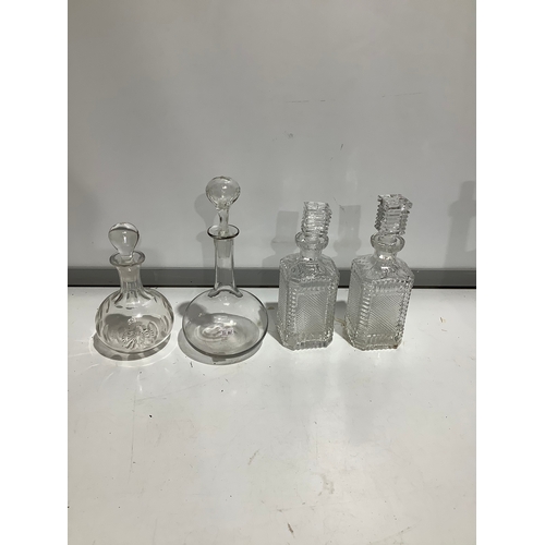 495 - 4 x glass decanters with original stoppers and no damage