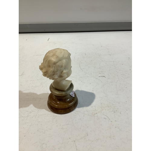 156 - Small model of girls head on stand