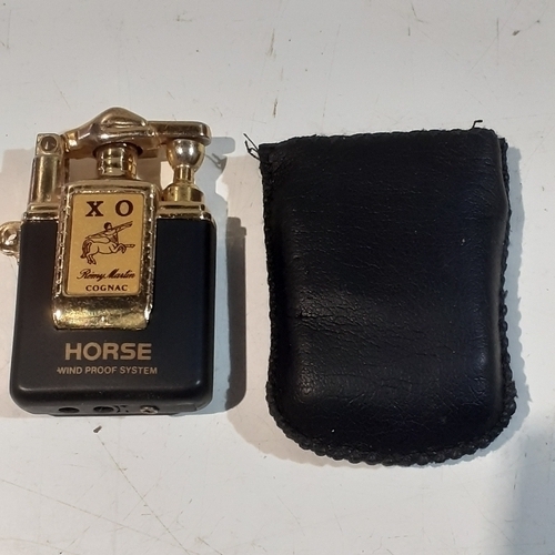 19 - XO remy martin zipper style lighter. Not tested but good condition