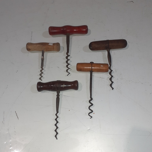 21 - A collection of wooden handled vintage corkscrews.  Nice condition