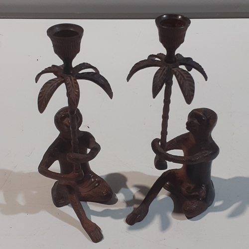 49 - Art nouveau style metal monkey and palm tree candlesticks. Good condition