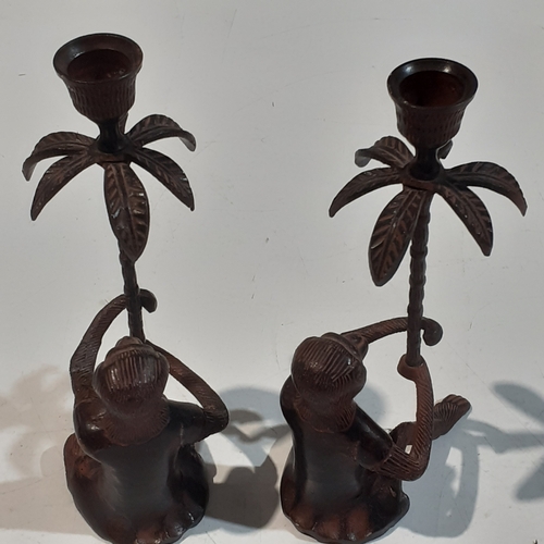 49 - Art nouveau style metal monkey and palm tree candlesticks. Good condition