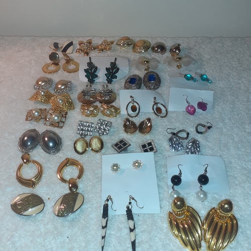 53 - A large quantity of costume jewellery earrings.  Mostly clip on. Some very attractive stones and no ... 