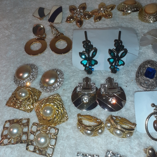 53 - A large quantity of costume jewellery earrings.  Mostly clip on. Some very attractive stones and no ... 