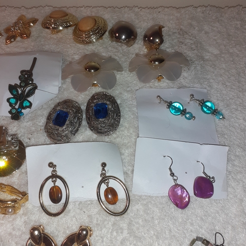 53 - A large quantity of costume jewellery earrings.  Mostly clip on. Some very attractive stones and no ... 