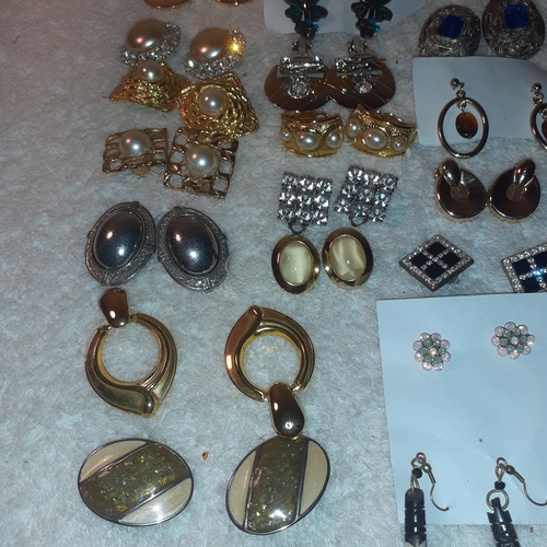 53 - A large quantity of costume jewellery earrings.  Mostly clip on. Some very attractive stones and no ... 