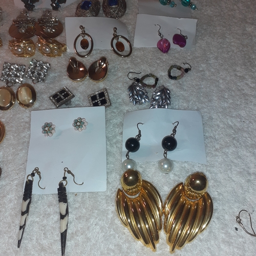 53 - A large quantity of costume jewellery earrings.  Mostly clip on. Some very attractive stones and no ... 