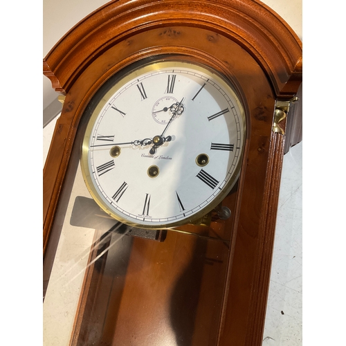 285 - Large wooden wall mounted Commiti of London clock with original instructions and key