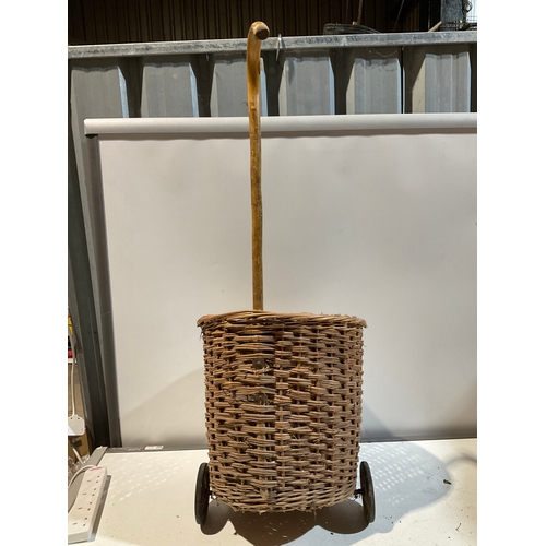 287 - Large wicker shopping trolley on wheels