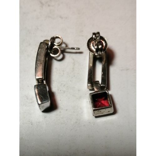 24A - Silver earrings each set with single square cut red gemstone 4.43 grams