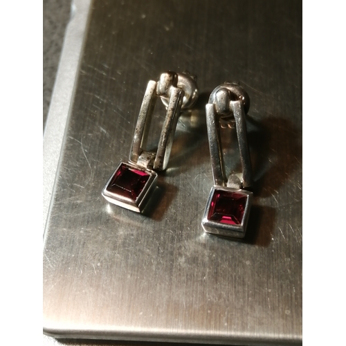 24A - Silver earrings each set with single square cut red gemstone 4.43 grams