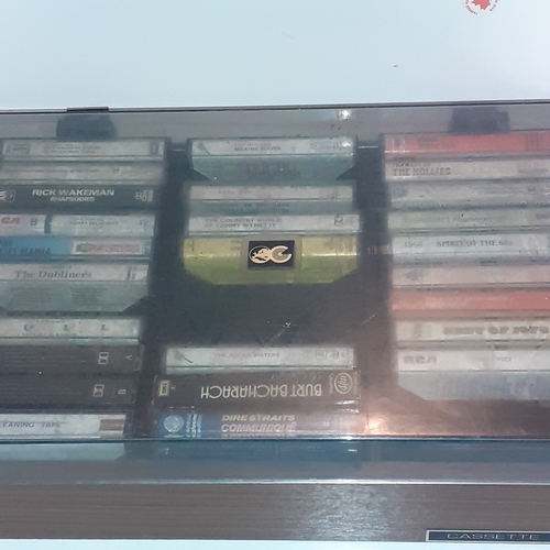 15 - A quantity of vintage cassette tapes in case. Including 10cc, The best of 1976, The Hollies and more... 