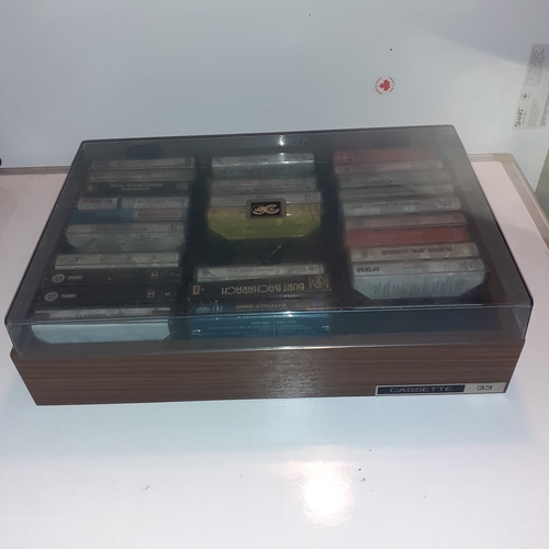 15 - A quantity of vintage cassette tapes in case. Including 10cc, The best of 1976, The Hollies and more... 