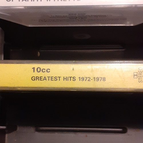 15 - A quantity of vintage cassette tapes in case. Including 10cc, The best of 1976, The Hollies and more... 