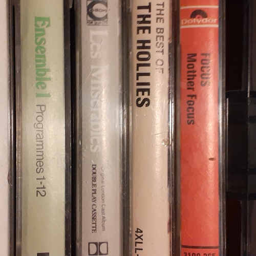 15 - A quantity of vintage cassette tapes in case. Including 10cc, The best of 1976, The Hollies and more... 