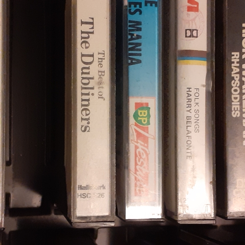 15 - A quantity of vintage cassette tapes in case. Including 10cc, The best of 1976, The Hollies and more... 