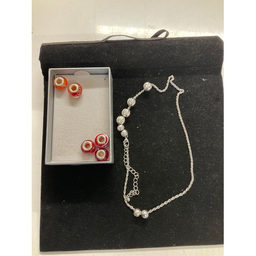 350 - 7 x glass style charm beads and silver coloured necklace