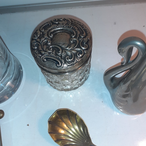 7 - An interesting selection of mainly metal pieces. Includes a ships wheel clock, some silver plate,  a... 