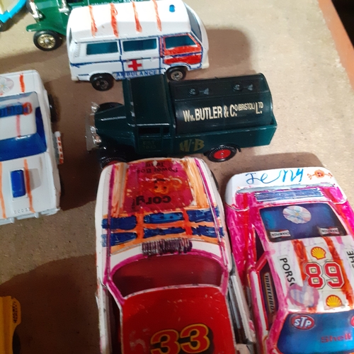 355 - Quantity of Diecast vehicles Corgi and matchbox etc. Some have been drawn on /coloured pen. Will nee... 