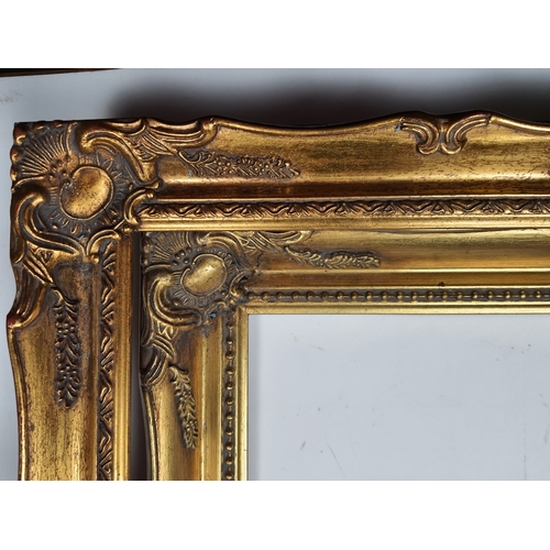 202A - 2 fully moulded, gold coloured picture frames for pictures sized 11 inches. x 14 inches. Size: 36 cm... 